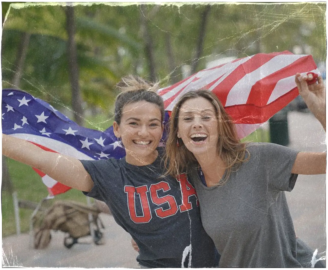 Two patriotic young women with an American flag