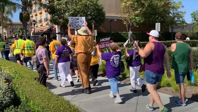 Thousands of Disneyland theme park employees in California have authorized a strike against the company due to unfair labor practices.