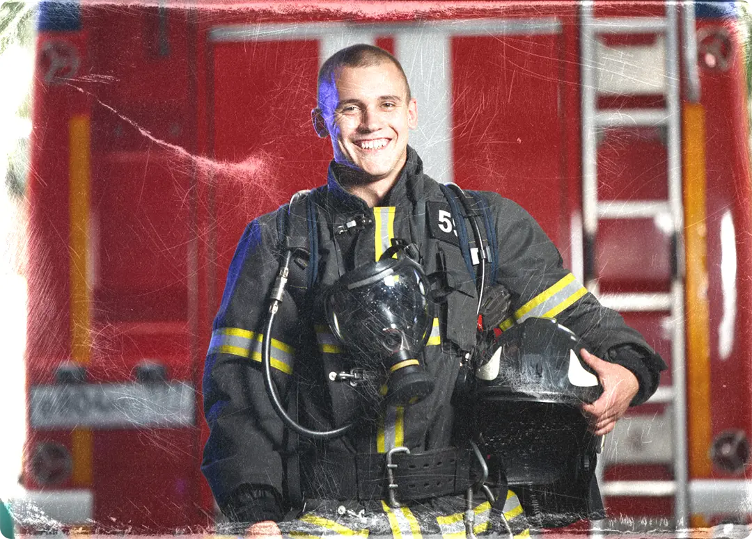 http://Firefighter%20in%20front%20of%20a%20fire%20truck